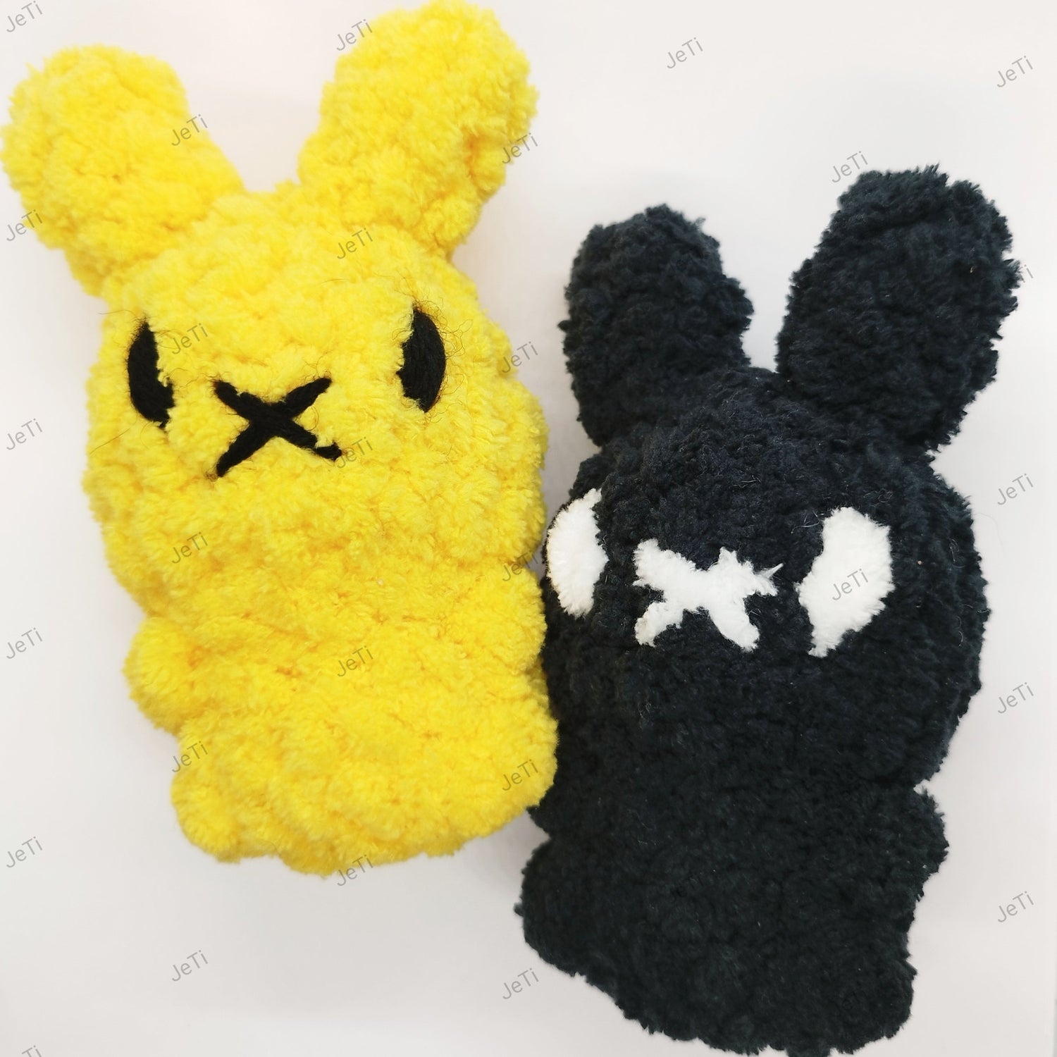 Handmade crochet bunny toys in yellow and black with embroidered faces