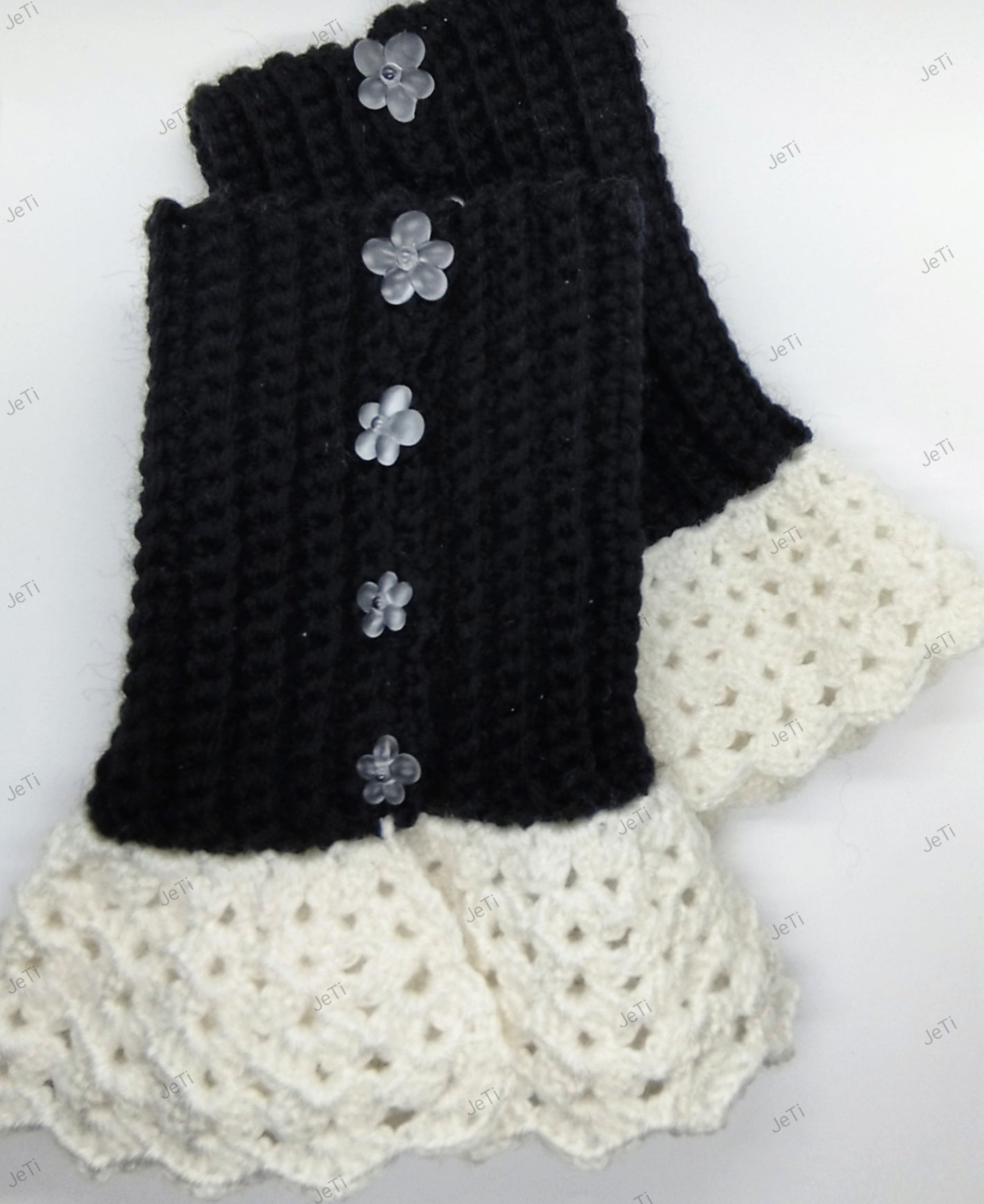 Handmade black and white crochet wrist cuffs with flower details, elegant lace style accessories
