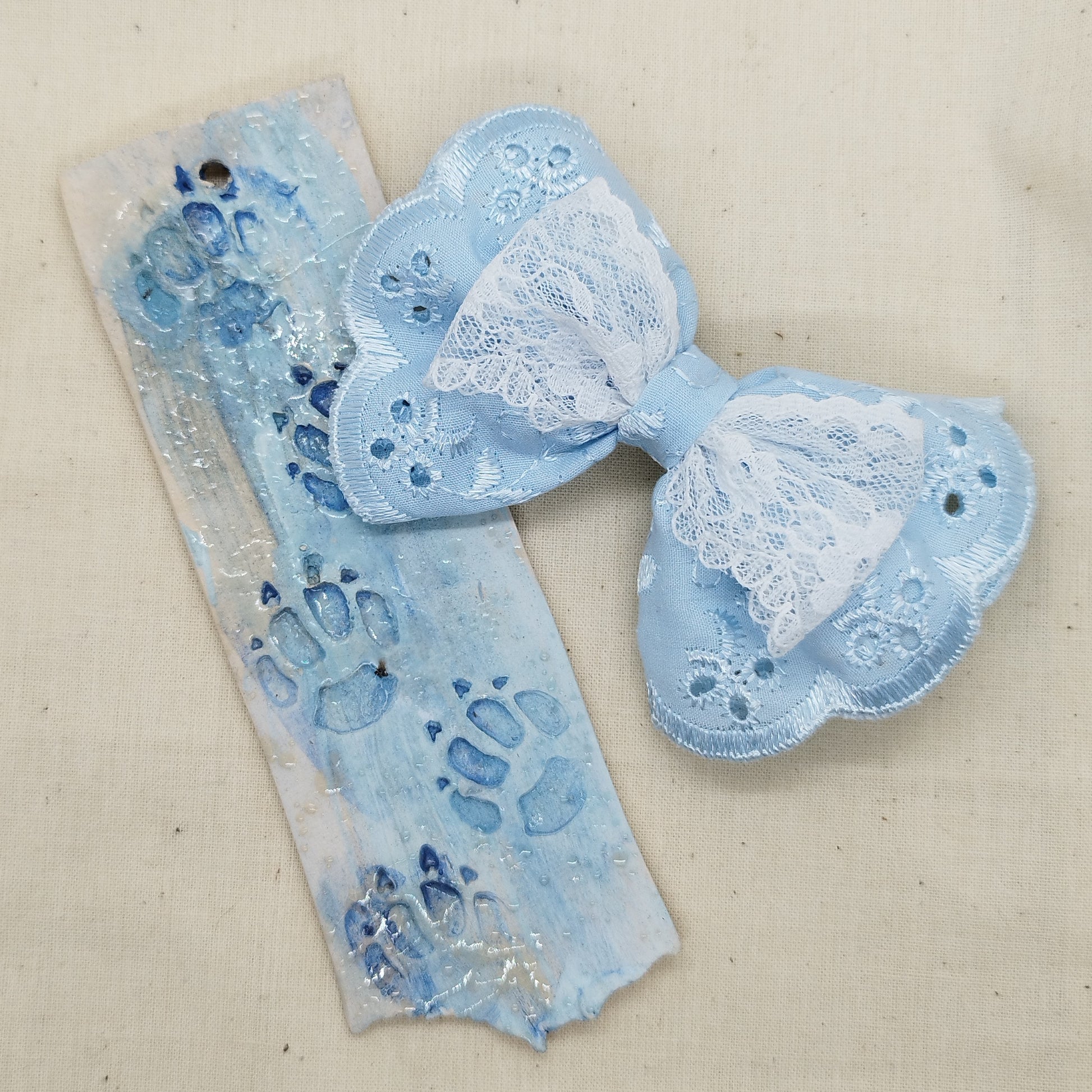 Handmade baby blue lace hair bow with white lace detail