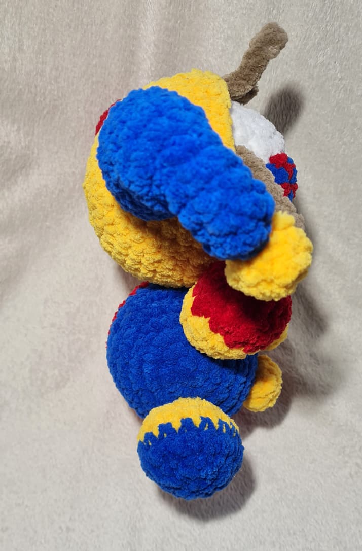 crochet clown plush toy inspired by digital circus character side view handmade