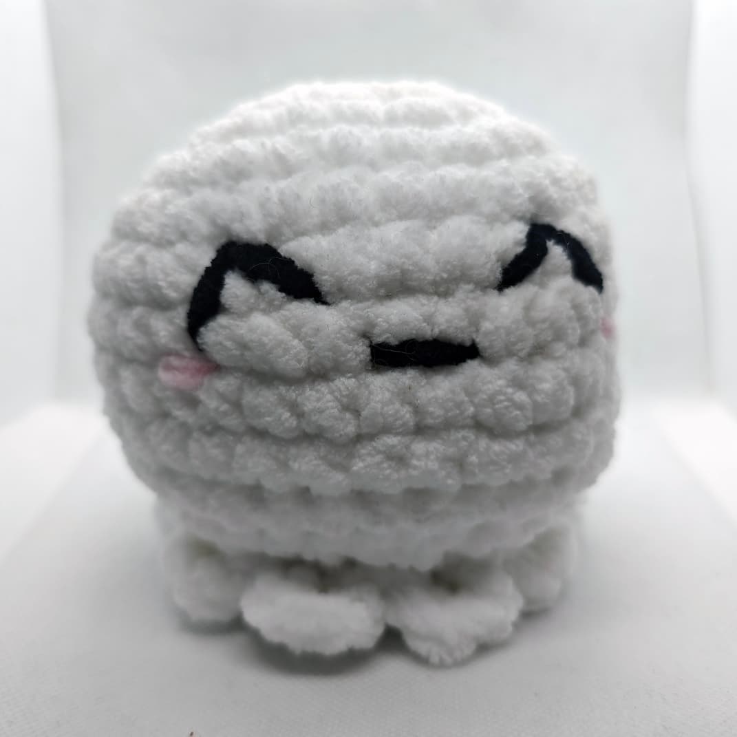 Cute handmade crochet ghost plush toy Squishy Boo close-up