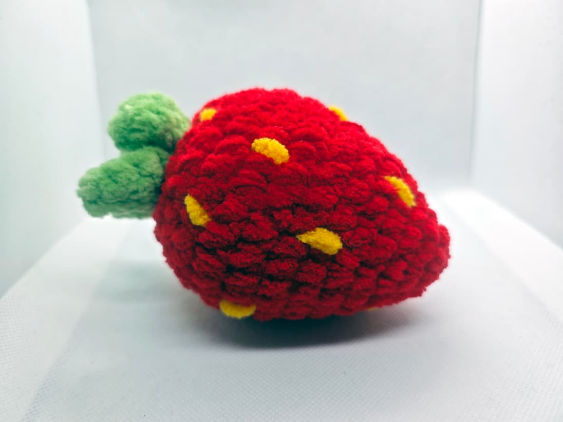 Crochet popping strawberry fidget toy red handmade close-up