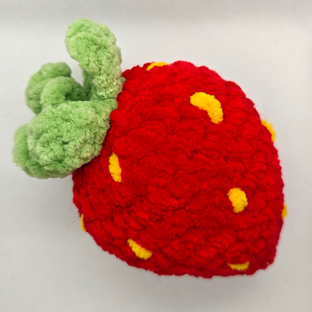 Soft crochet strawberry toy with popping texture for stress relief