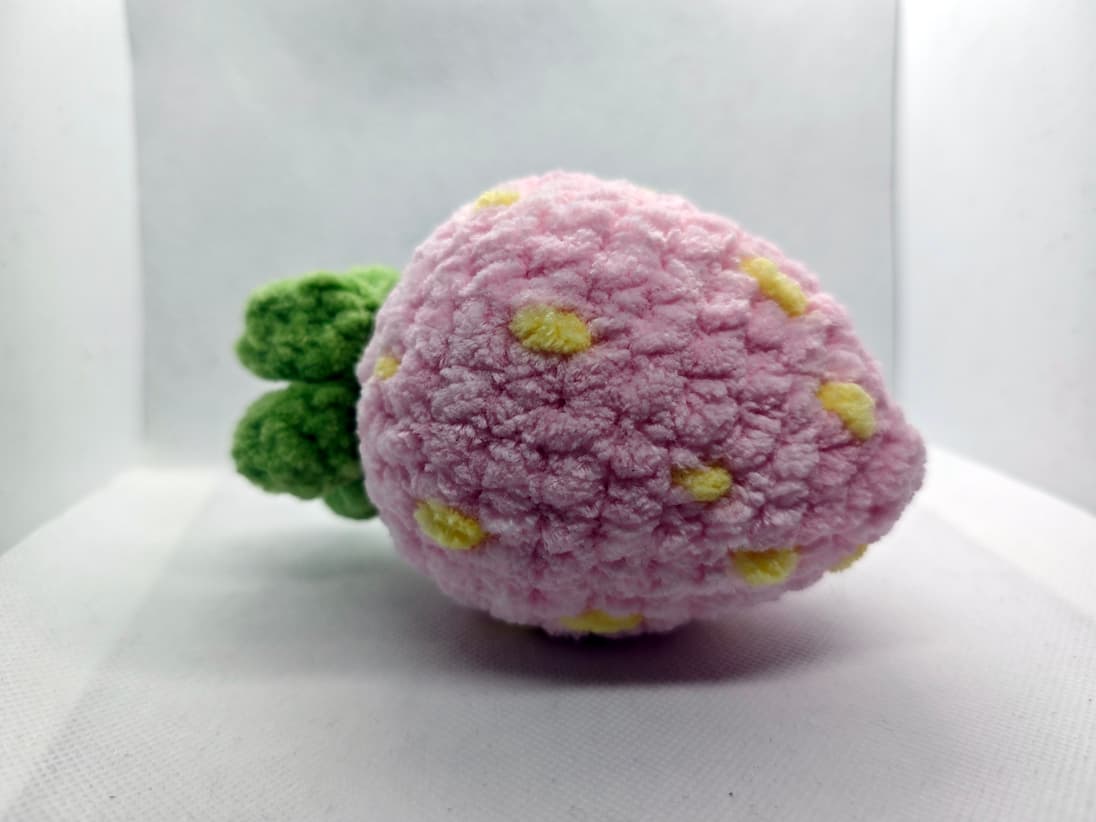 Soft pastel pink crochet strawberry for stress relief