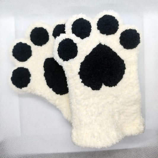 Hand wearing paw fingerless gloves showing soft fluffy texture