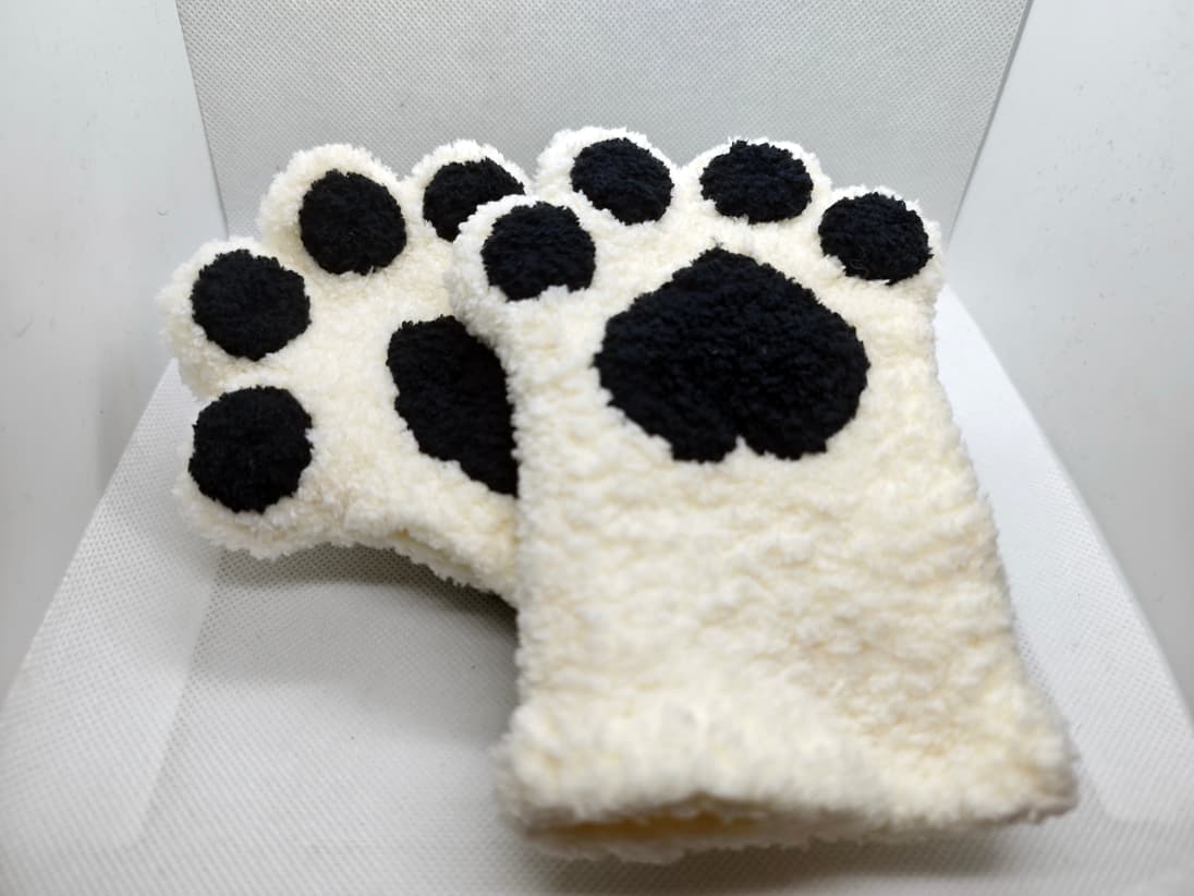 Cute paw fingerless gloves with black paw pads close-up